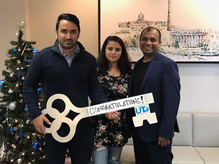 Clients with the giant congratulations key at closing